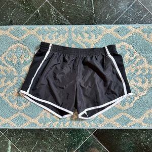 Black athletic shorts with white trim